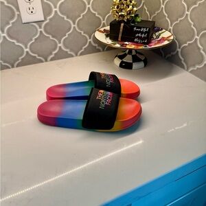 The North Face pride rainbow slides